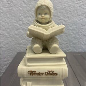 A Vintage Musical Ivory Snowbabies Figurine